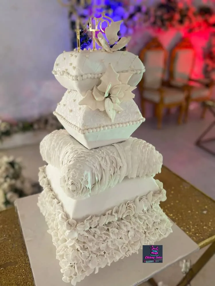 Detailed luxury white tiered cake