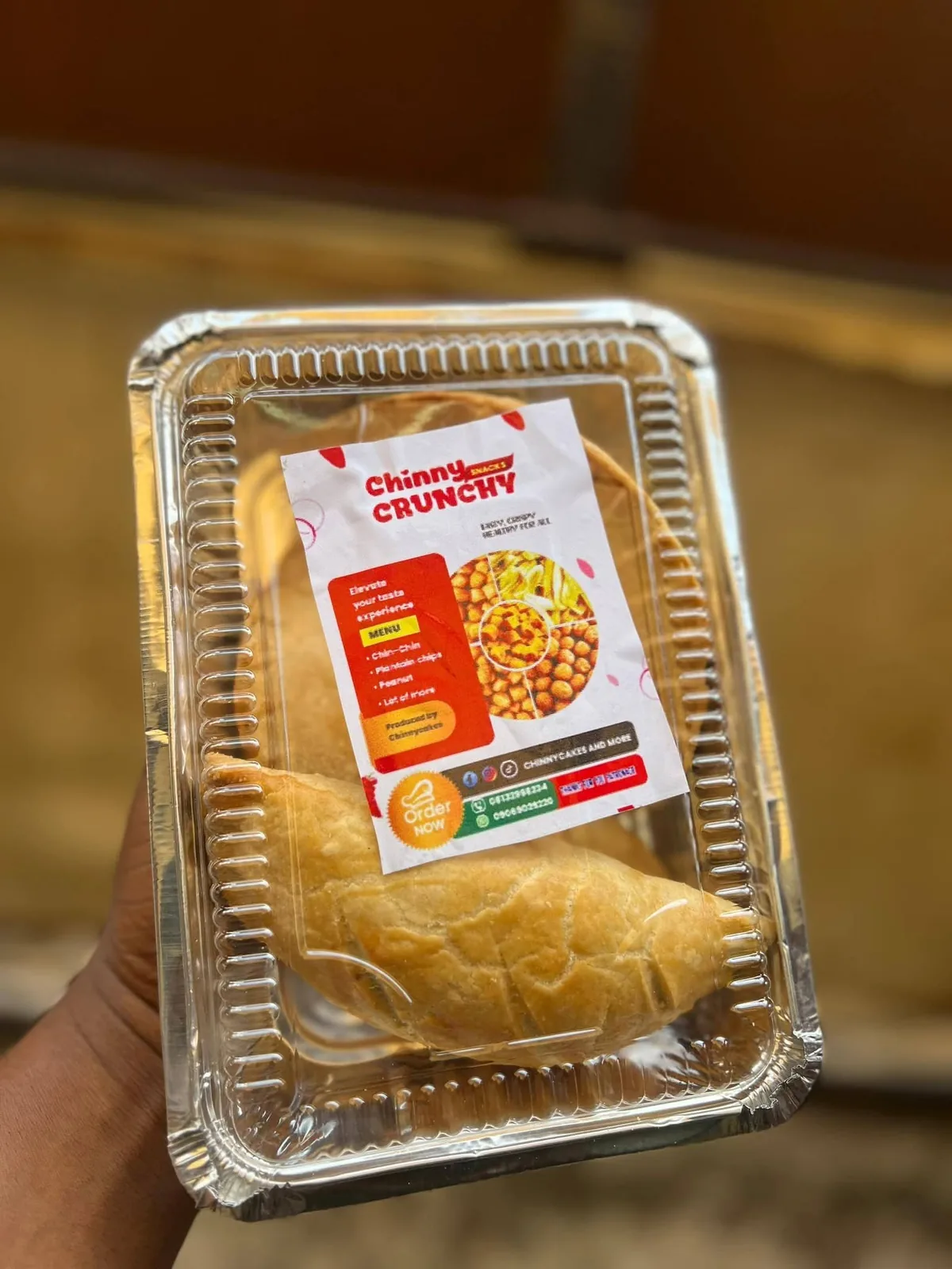 Packaged pastry in a clear-lidded foil container