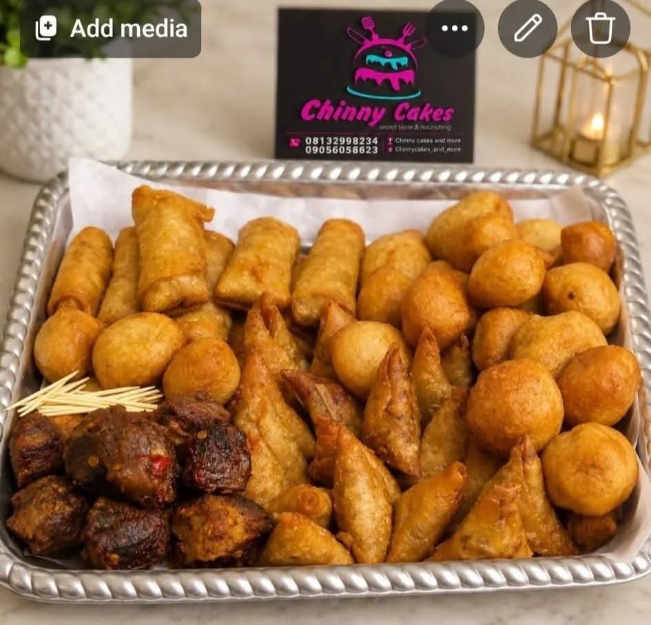 Assorted small chops arranged in a large tray