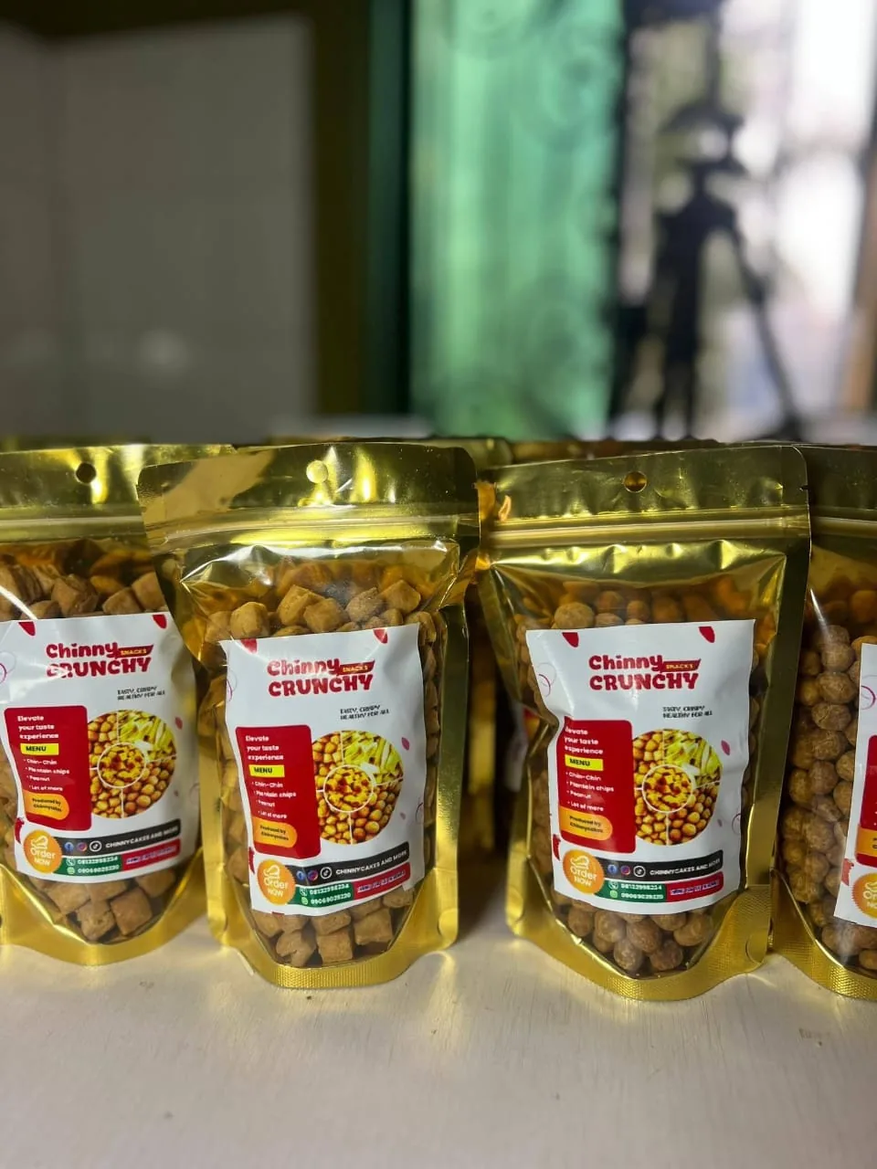 Gold resealable pouches of Chinny Crunchy snacks
